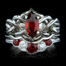 Four piece puzzle ring bridal set with one carat marquise garnet and wedding ring with garnets and diamonds