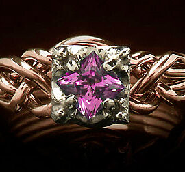 rose gold puzzle engagement ring with lab created pink sapphire