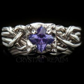 Guinevere four piece puzzle ring with princess cut tanzanite