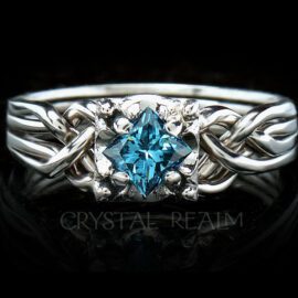 Princess cut blue diamond on Guinevere four band puzzle ring